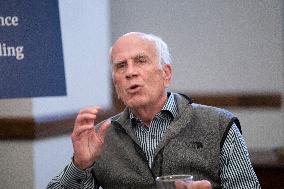 United States Senator Peter Welch (Democrat of Vermont) gives pen and pad on reformation of FEMA