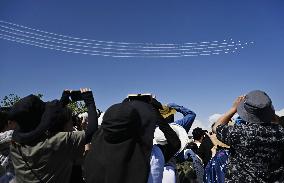 Blue Impulse aerobatic team flies over Osaka