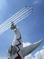 Blue Impulse aerobatic team flies over Osaka
