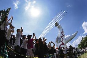 Blue Impulse aerobatic team flies over Osaka