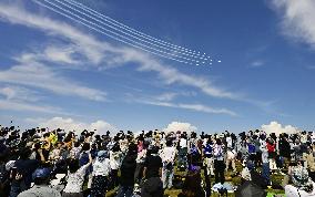 Blue Impulse aerobatic team flies over Osaka