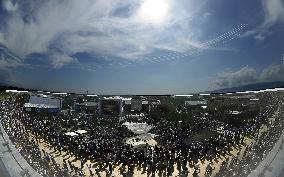 Blue Impulse aerobatic team flies over Osaka