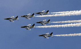 Blue Impulse aerobatic team flies over Osaka