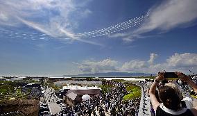 Blue Impulse aerobatic team flies over Osaka