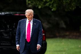 US President Donald Trump boards Marine One