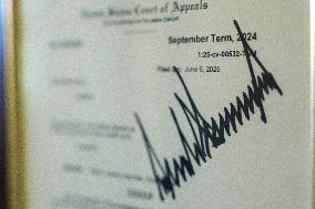 Trump-Signed Court Order Allowing Ban of Associated Press from Pool Displayed in Press Briefing Room of White House