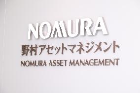 Nomura Asset Management signboard and logo