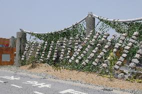 750 stones hung like a necklace at the Expo Rest Area (Osaka, Kansai Expo venue)