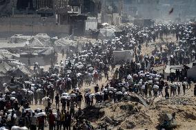 Palestinians Carry Flour As Humanitarian Aid Reaches Gaza