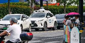 L4-level AI Autonomous Driving Car Experience Event at the 2025 WAIC in Shanghai