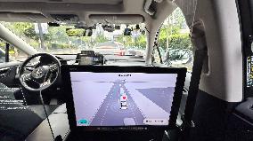 L4-level AI Autonomous Driving Car Experience Event at the 2025 WAIC in Shanghai