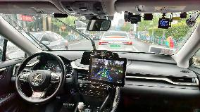 L4-level AI Autonomous Driving Car Experience Event at the 2025 WAIC in Shanghai