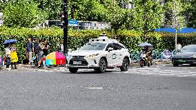 L4-level AI Autonomous Driving Car Experience Event at the 2025 WAIC in Shanghai