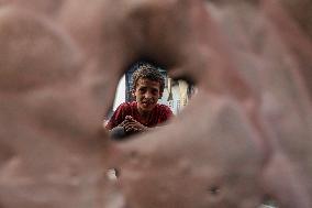 Displaced Family Prepares Meal Amid Food Shortages - Gaza City