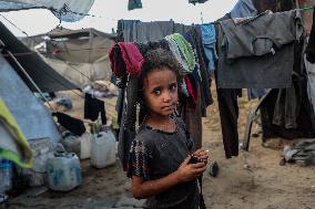 Displaced Family Prepares Meal Amid Food Shortages - Gaza City