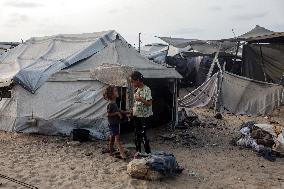 Displaced Family Prepares Meal Amid Food Shortages - Gaza City