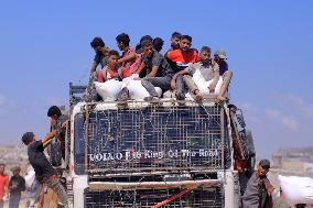 Palestinians Carry Humanitarian Aid - Gaza Strip