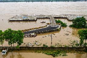 Boatmen Navigate Flooded Yamuna Riverbank