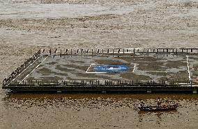 Boatmen Navigate Flooded Yamuna Riverbank