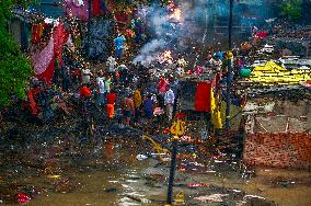 Flood Forces Cremations to Higher Ground
