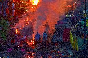 Flood Forces Cremations to Higher Ground