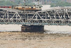 Train Crosses Yamuna Bridge Amid Rising Waters