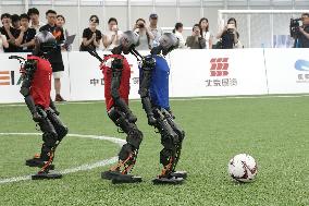 Humanoid robots play football