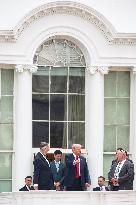 DC: President Trump walks on roof of the West Wing of the White House