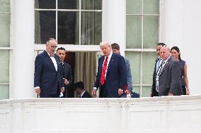 DC: President Trump walks on roof of the West Wing of the White House