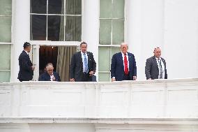 DC: President Trump walks on roof of the West Wing of the White House