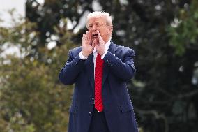 DC: President Trump walks on roof of the West Wing of the White House