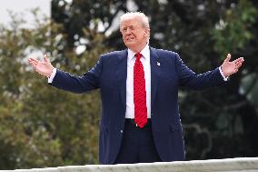 DC: President Trump walks on roof of the West Wing of the White House