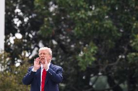 DC: President Trump walks on roof of the West Wing of the White House