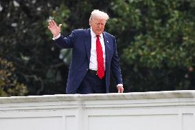 DC: President Trump walks on roof of the West Wing of the White House