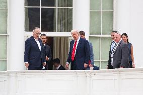 DC: President Trump walks on roof of the West Wing of the White House