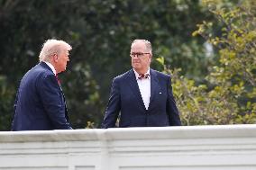 DC: President Trump walks on roof of the West Wing of the White House