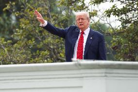 DC: President Trump walks on roof of the West Wing of the White House