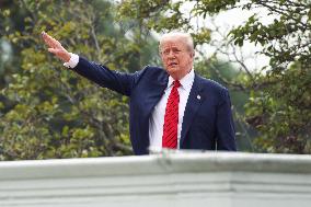 DC: President Trump walks on roof of the West Wing of the White House