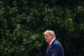 DC: President Trump walks on roof of the West Wing of the White House
