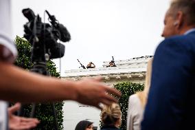 DC: President Trump walks on roof of the West Wing of the White House