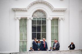 DC: President Trump walks on roof of the West Wing of the White House
