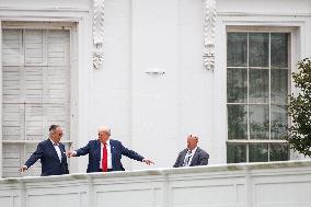 DC: President Trump walks on roof of the West Wing of the White House