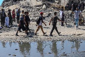 Gazans Flock to Aid Distribution Point - Gaza