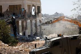 Israeli Excavators Demolish a Building - West Bank