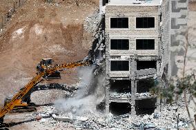 Israeli Excavators Demolish a Building - West Bank