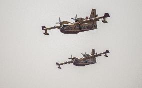 Canadair planes during their refilling on the Etang de Bages - Aude