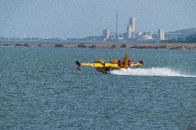 Canadair planes during their refilling on the Etang de Bages - Aude