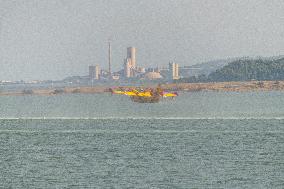 Canadair planes during their refilling on the Etang de Bages - Aude