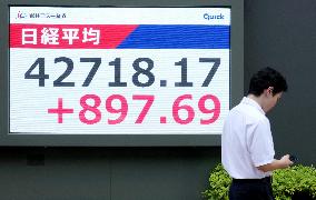 Nikkei stock index ends at record high