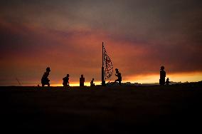 Illustration - Silhouetted at Sunset Amidst Vancouver Island Wildfires - Canada